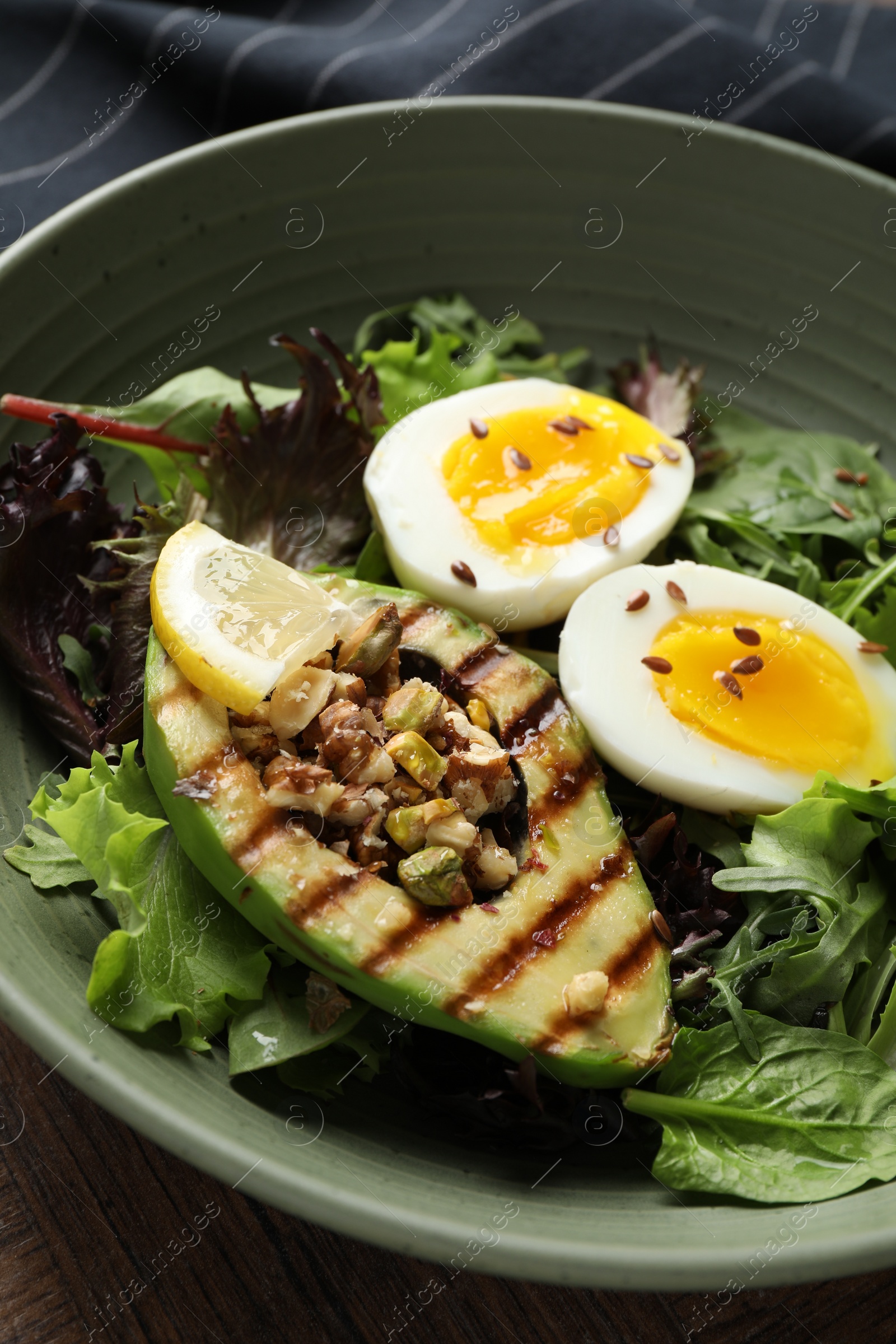 Photo of Healthy dish high in vegetable fats on table, closeup