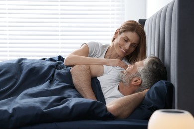 Photo of Lovely mature couple in bed at home