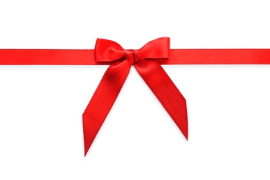 Photo of Red ribbon with bow on white background, top view