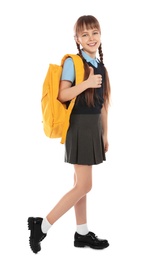 Full length portrait of cute girl in school uniform with backpack on white background