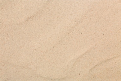 Photo of Dry beach sand as background, top view