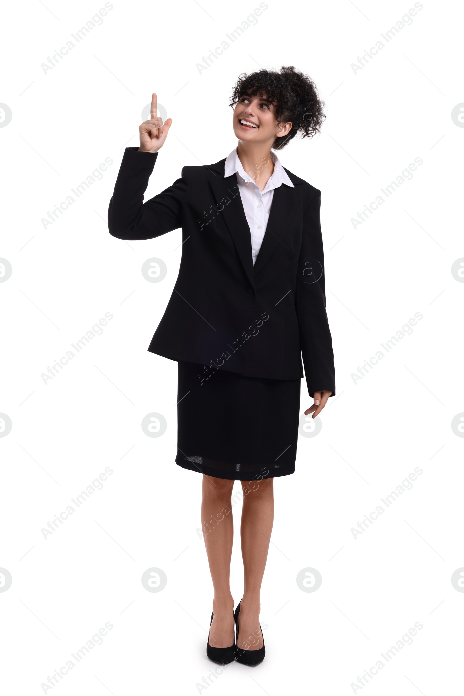 Photo of Beautiful happy businesswoman pointing at something on white background