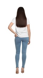 Woman wearing stylish light blue jeans on white background, back view