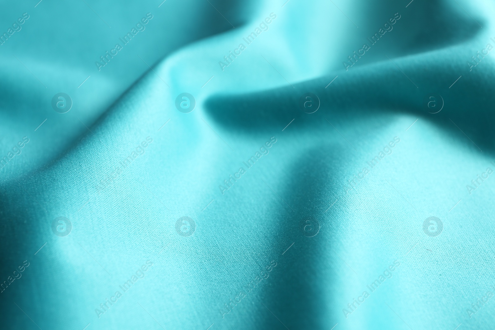 Photo of Texture of delicate blue fabric as background, closeup