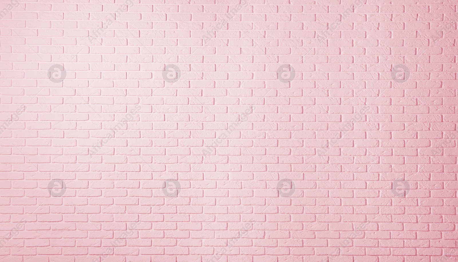 Image of Texture of pink color brick wall as background