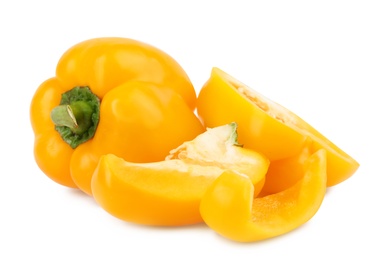 Photo of Whole and cut yellow bell peppers isolated on white