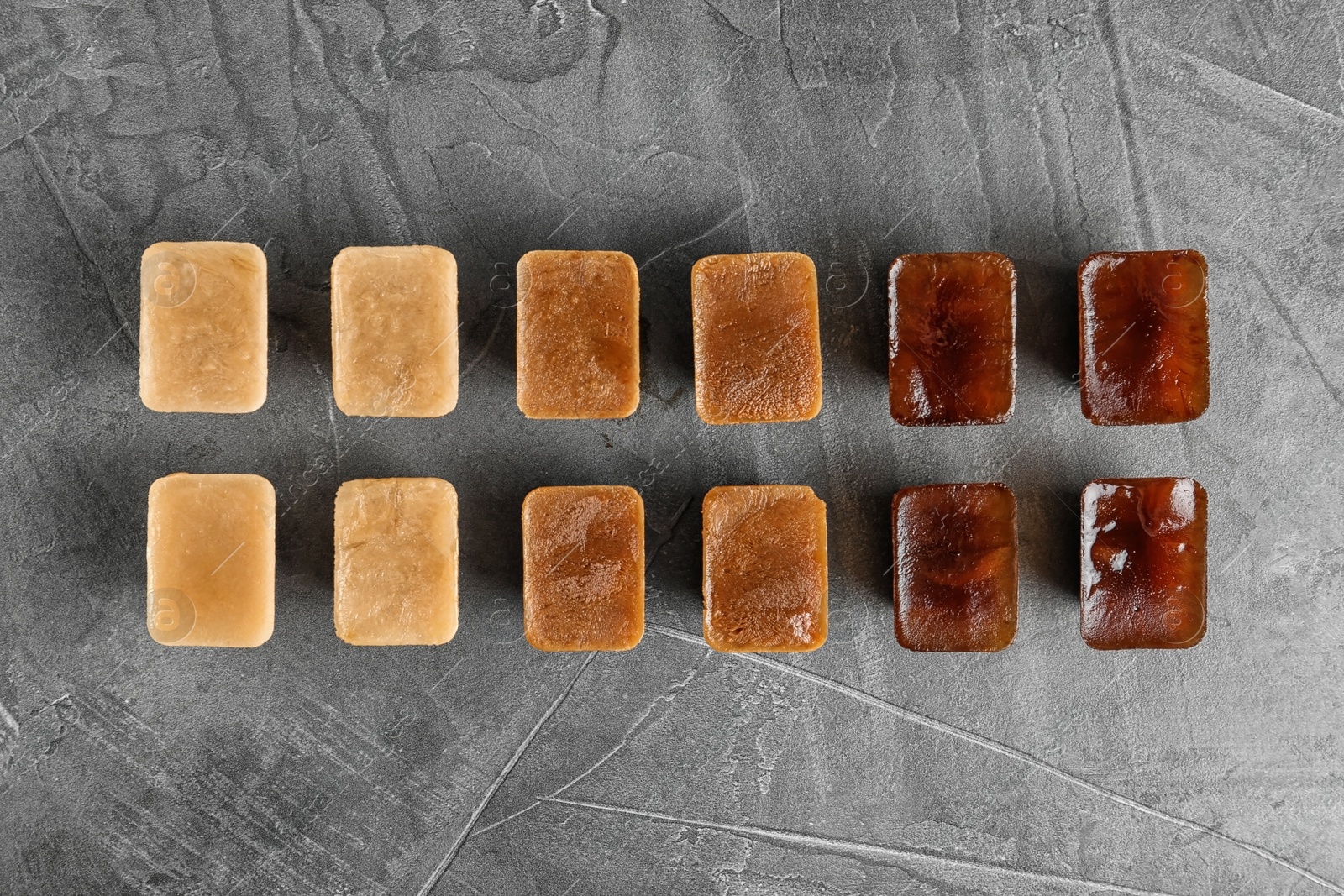 Photo of Flat lay composition with coffee ice cubes on grey background