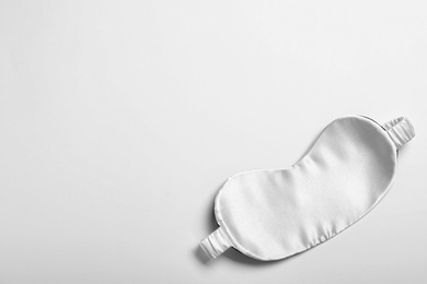 Sleeping mask isolated on white, top view. Bedtime accessory