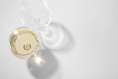 Tasty aromatic wine in glass isolated on white