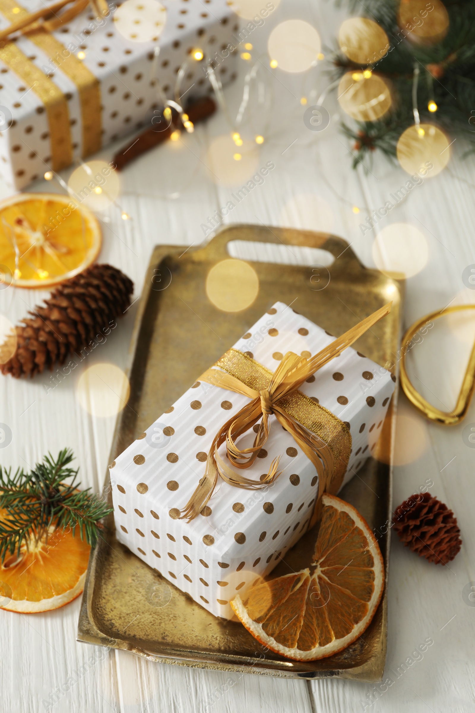 Photo of Composition with christmas gift box on white wooden table