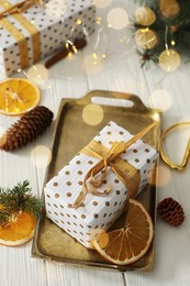 Photo of Composition with christmas gift box on white wooden table