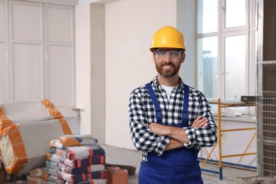Photo of Portrait of professional builder in uniform indoors