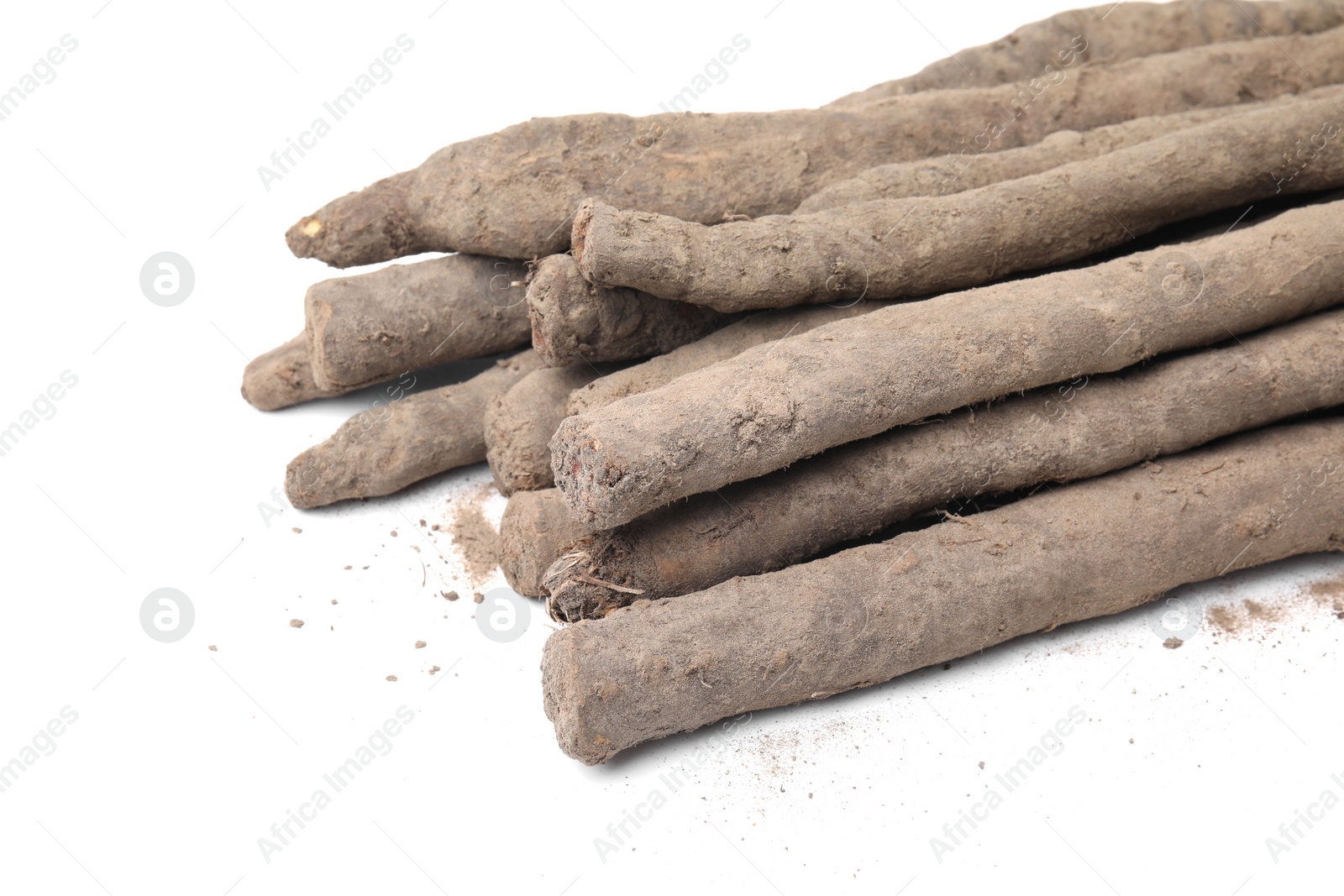 Photo of Fresh raw salsify roots on white background, closeup. Space for text