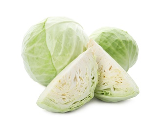 Whole and cut fresh ripe cabbages on white background