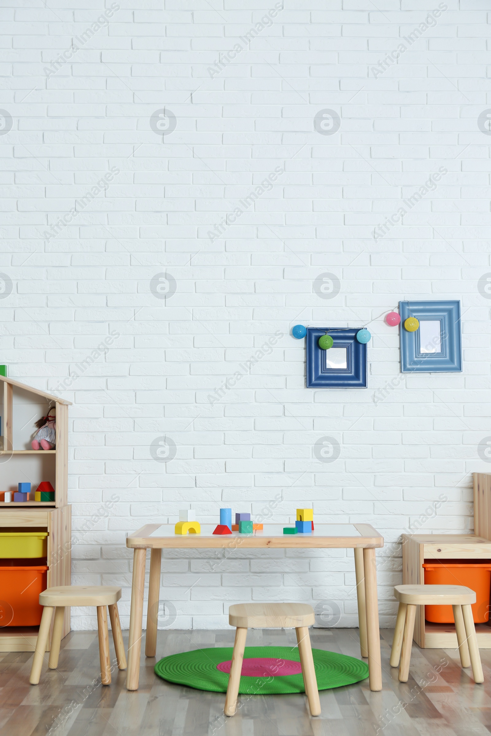 Photo of Modern child room interior with table and stools