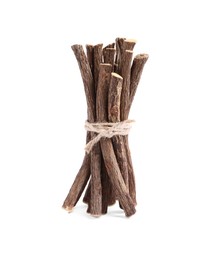 Photo of Dried sticks of liquorice root on white background