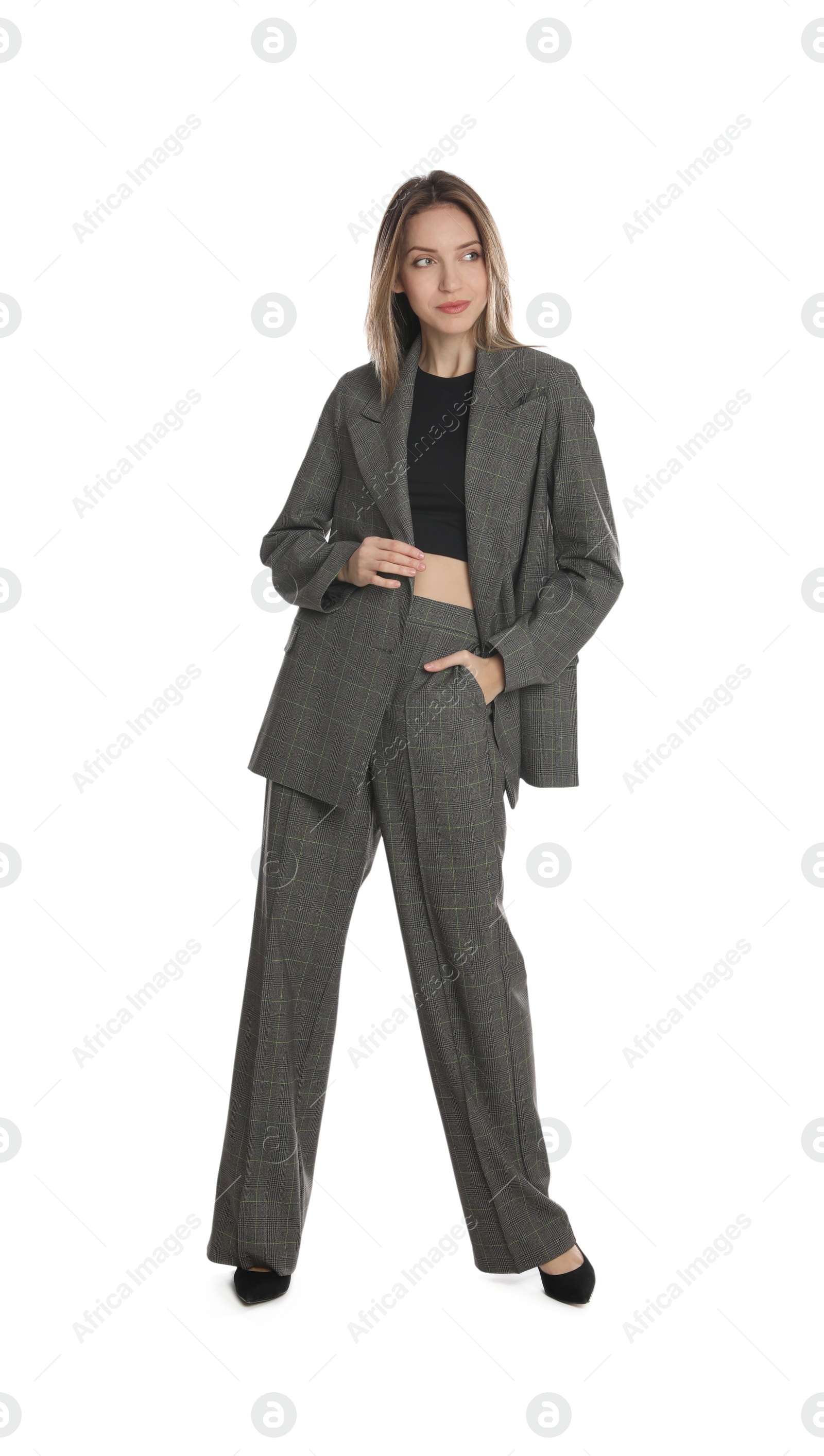 Photo of Full length portrait of beautiful young woman in fashionable suit on white background. Business attire