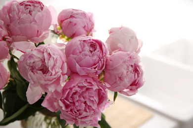 Photo of Bouquet of beautiful fresh pink peonies indoors, closeup