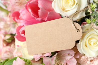 Photo of Happy Mother's Day. Beautiful flowers with blank card, closeup