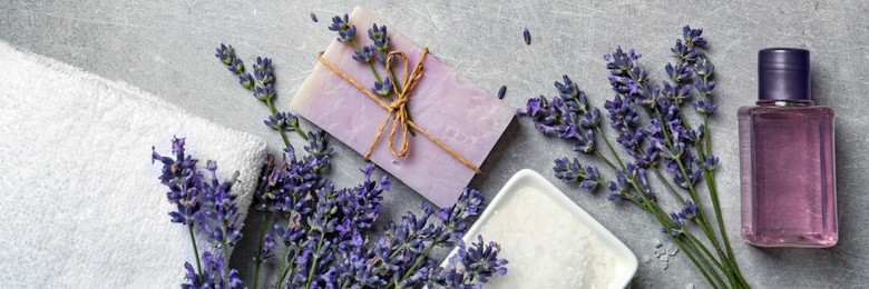 Image of Flat lay composition with spa cosmetic products on light grey table. Banner design