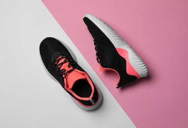 Pair of stylish sport shoes on color background, flat lay