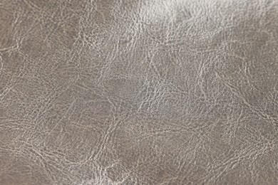 Natural leather with wrinkles as background, closeup view