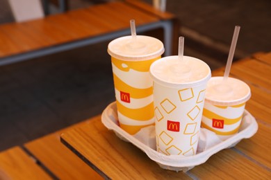 Photo of MYKOLAIV, UKRAINE - AUGUST 11, 2021: Cold McDonald's drinks on table in cafe