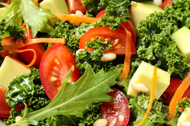 Photo of Tasty fresh kale salad as background, closeup