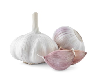 Fresh garlic bulbs and cloves on white background