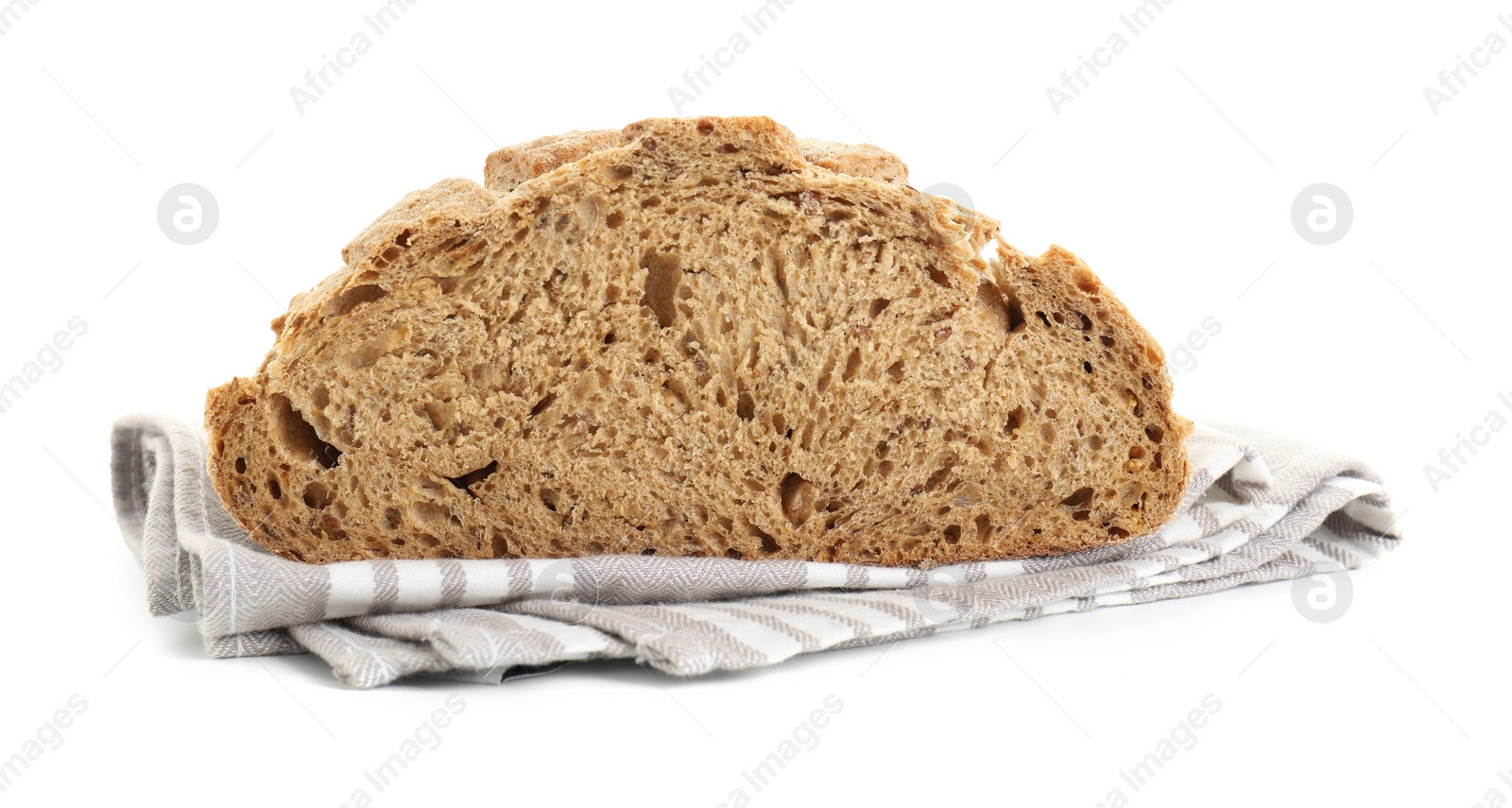 Photo of Freshly baked cut sourdough bread and napkin isolated on white