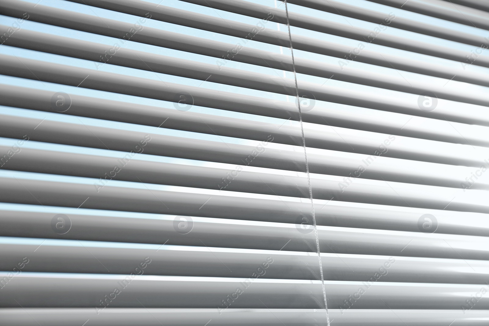 Photo of Closeup view of window with horizontal blinds, low angle view