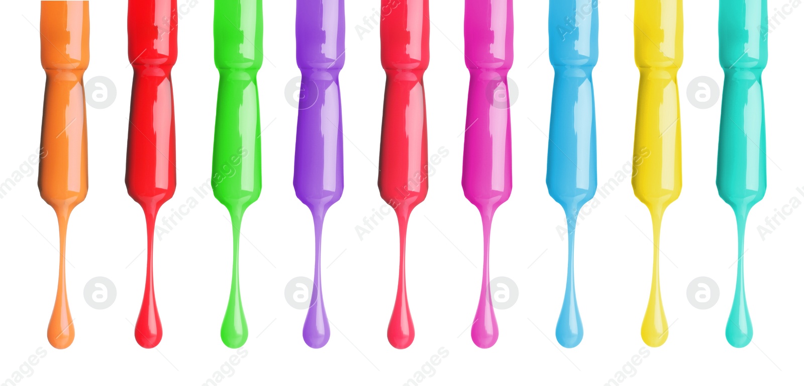 Image of Different color nail polish collection. Set of brushes with dripping liquid isolated on white