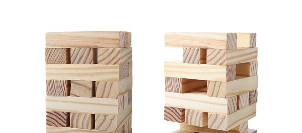 Image of Jenga towers of wooden blocks on white background