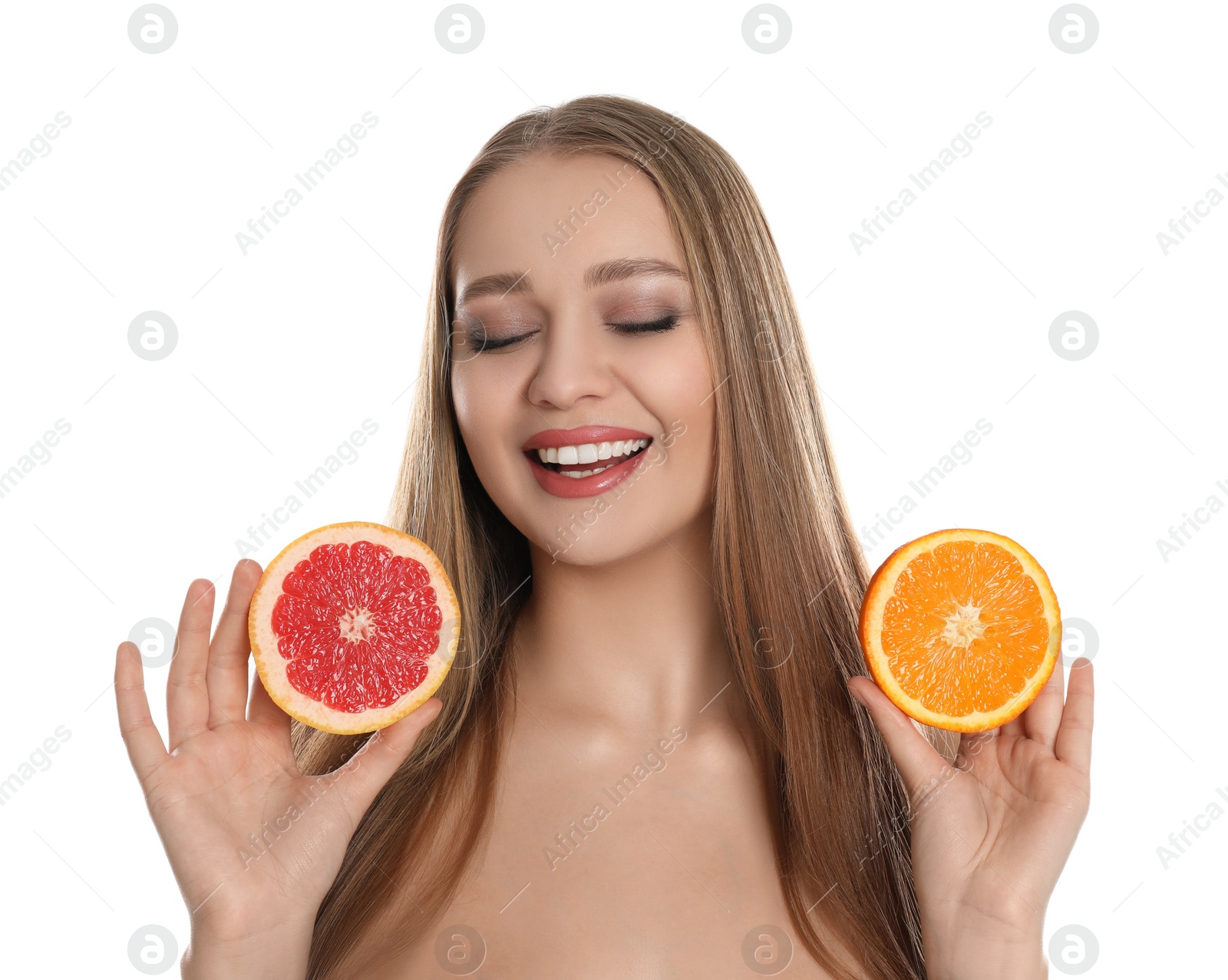 Photo of Young woman with cut orange and grapefruit on white background. Vitamin rich food