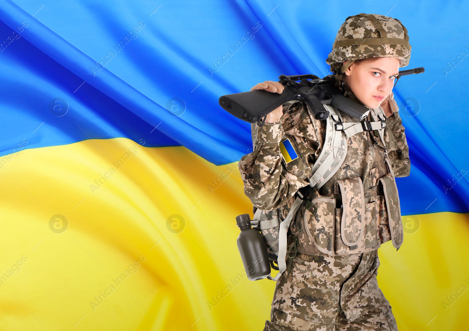 Image of Armed soldier in military camouflage uniform and Ukrainian flag on background, space for text. Stop war