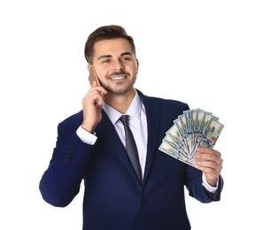 Young businessman with money and mobile phone on white background