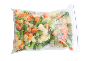 Photo of Frozen vegetables in plastic bag isolated on white, top view