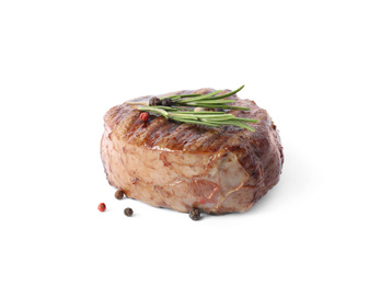 Photo of Delicious grilled beef medallion with rosemary and peppers mix isolated on white