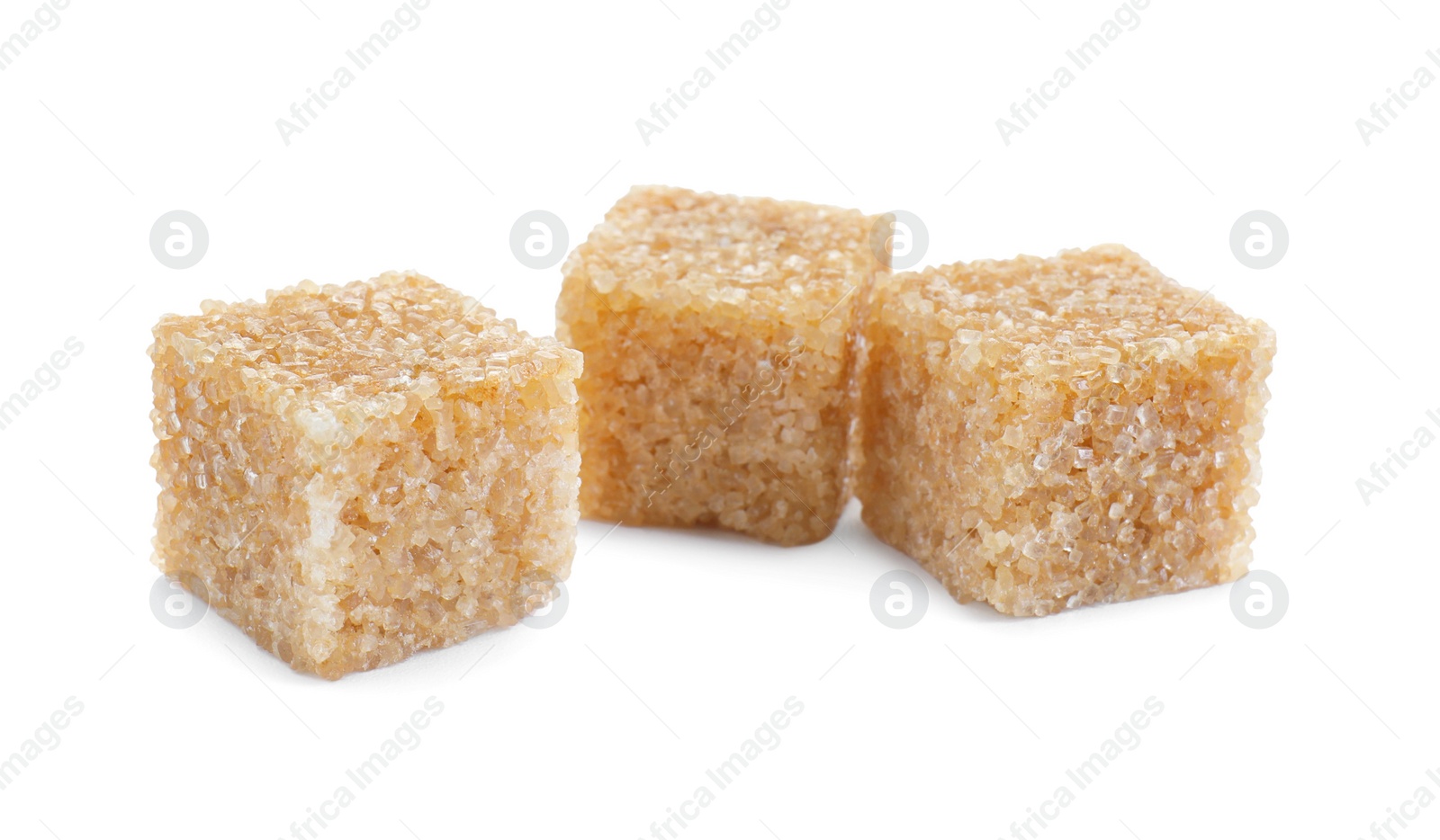 Photo of Three brown sugar cubes isolated on white