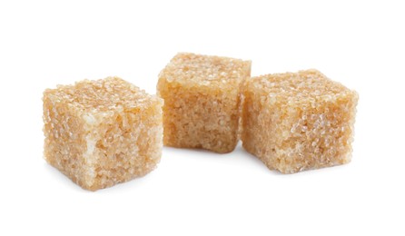 Photo of Three brown sugar cubes isolated on white