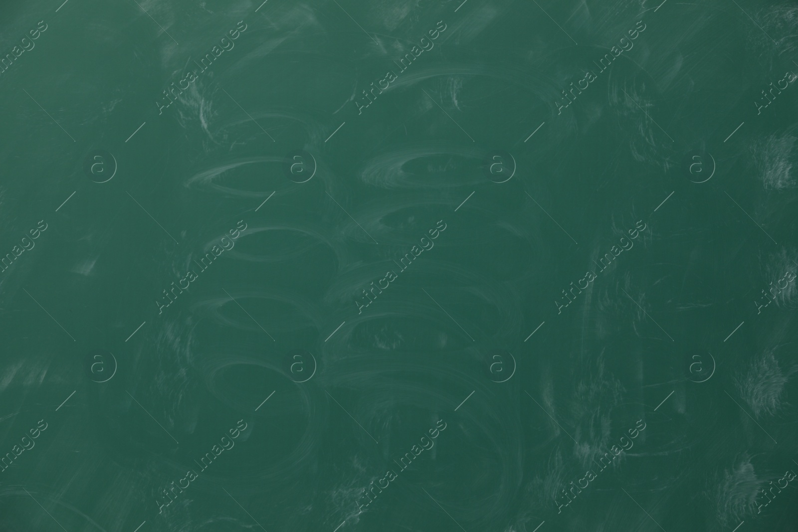 Photo of Dirty green chalkboard as background. School equipment