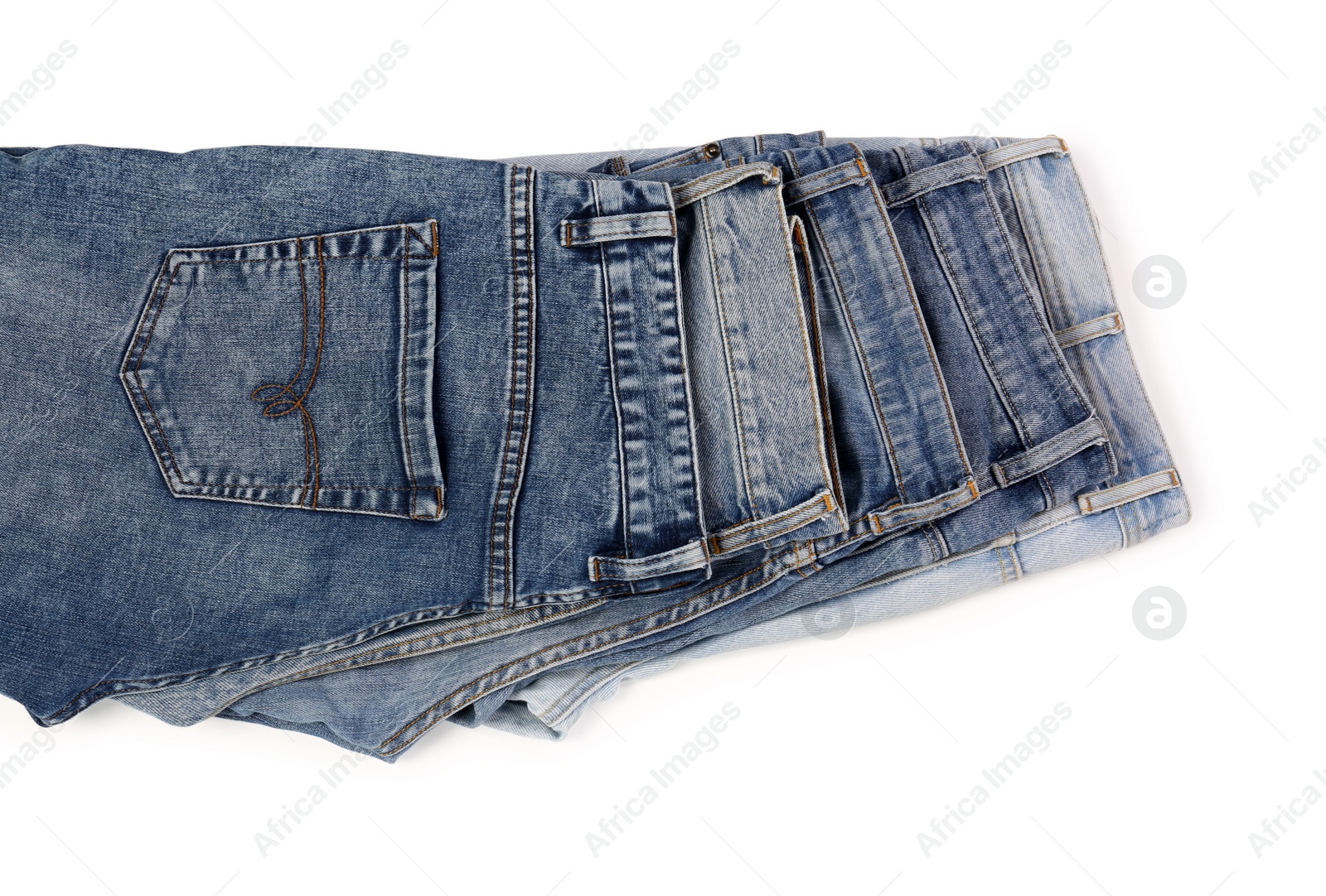 Photo of Different stylish jeans isolated on white, top view