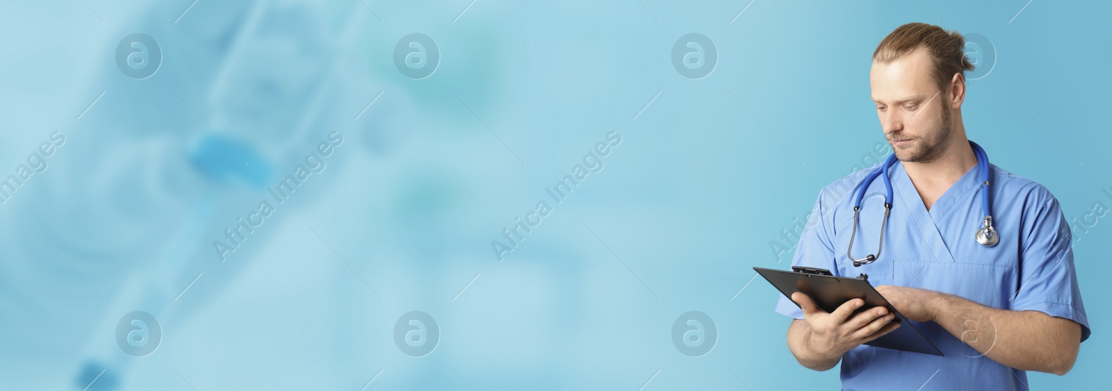 Image of Medical assistant with clipboard on light blue background, space for text. Health care worker