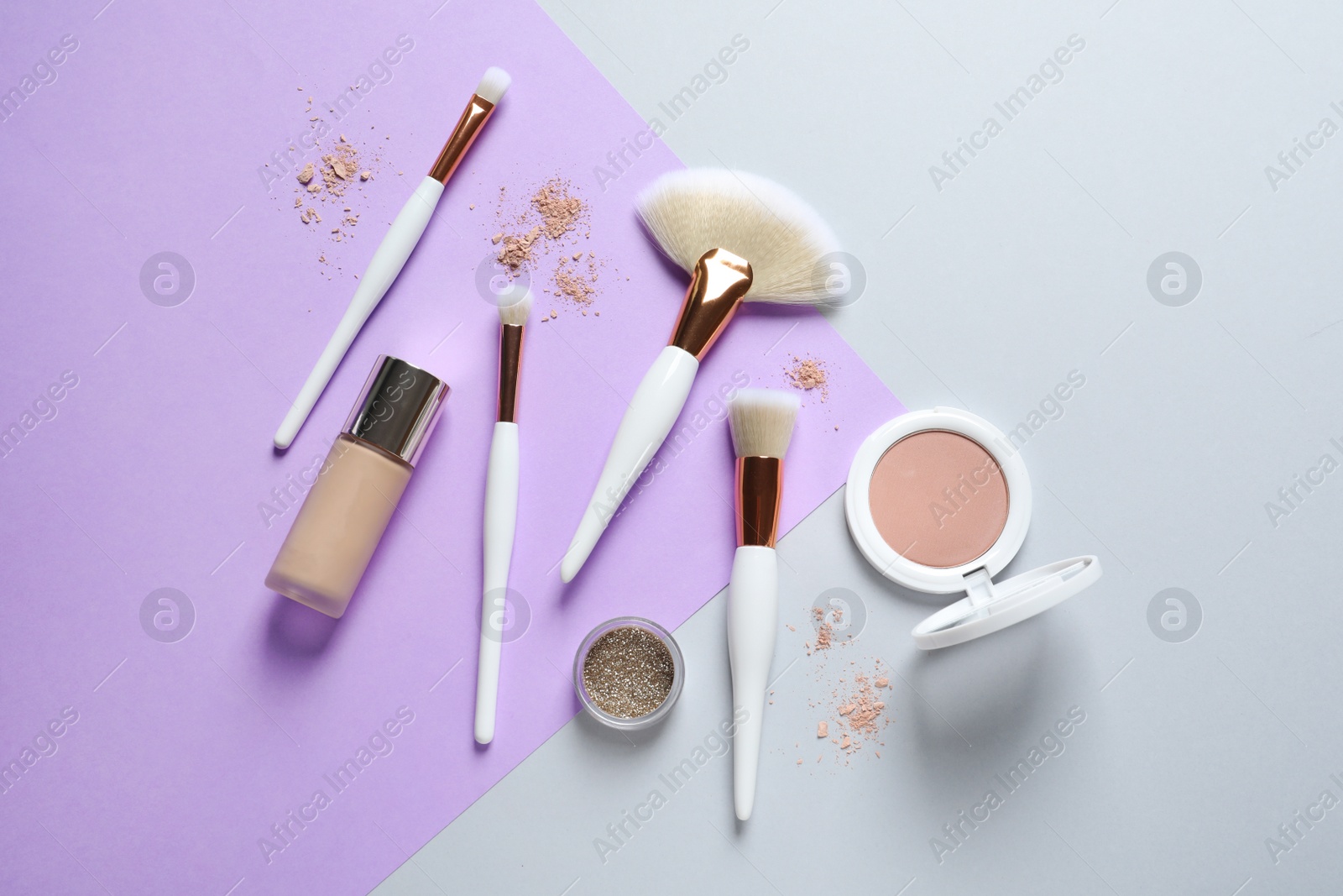 Photo of Flat lay composition with makeup brushes on color background