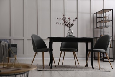 Photo of Beautiful dining room interior with new stylish furniture