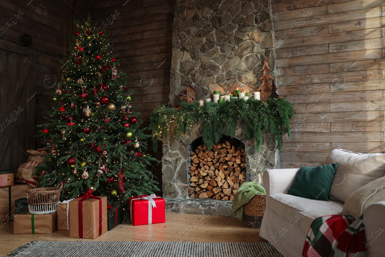 Photo of Festive interior with decorated Christmas tree and fireplace