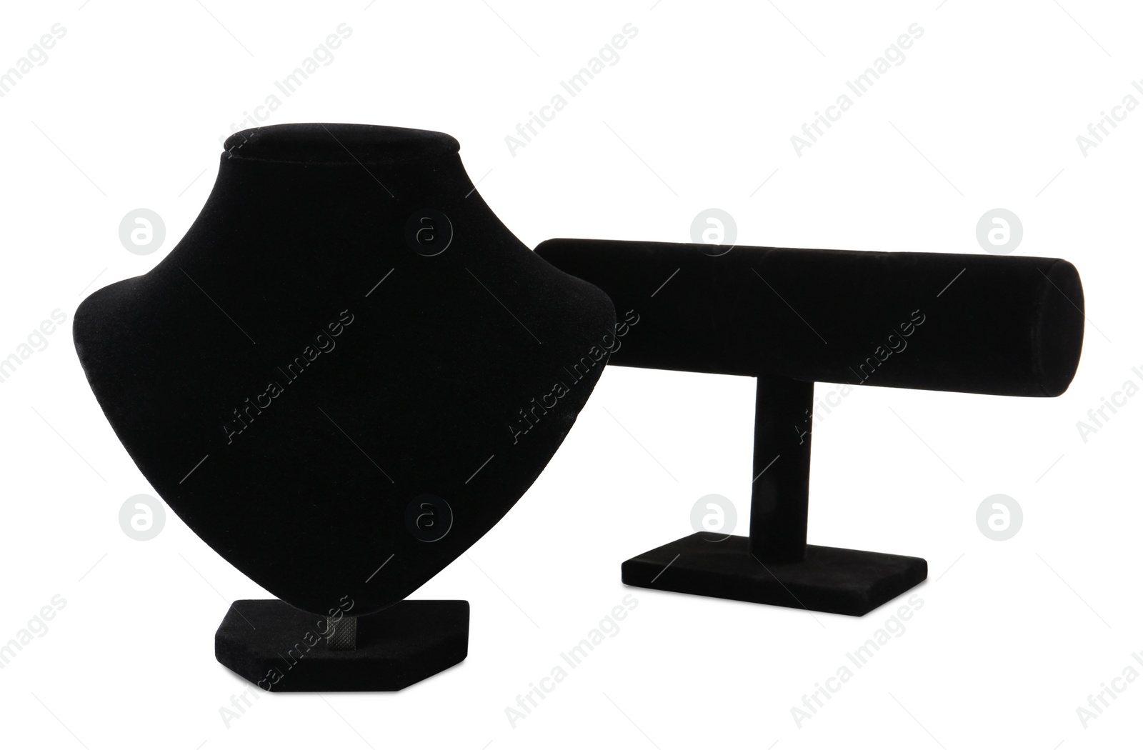 Photo of Different empty black velvet jewelry stands on white background