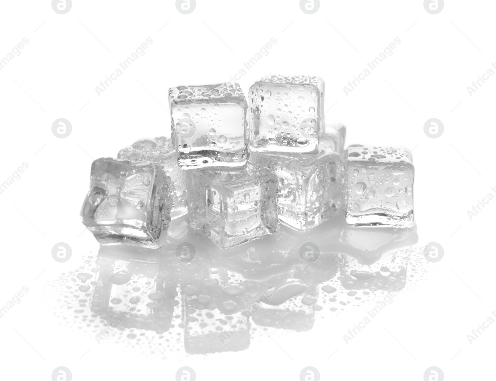 Photo of Pile of crystal clear ice cubes on white background