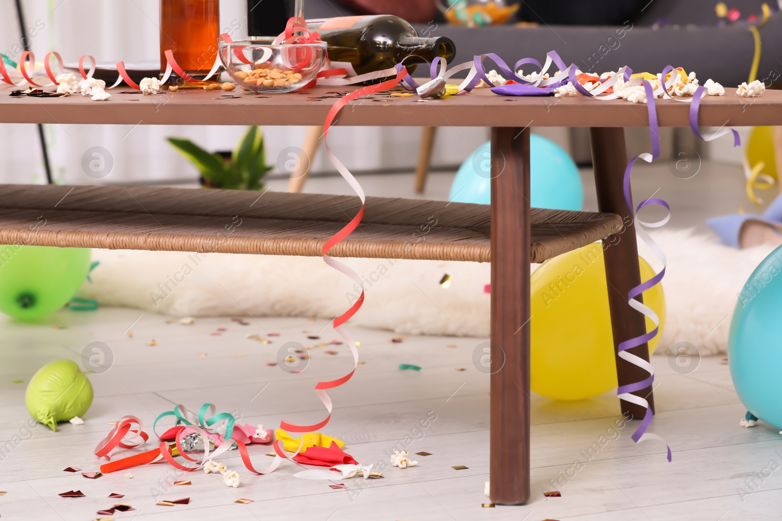 Photo of Wooden table with mess after party indoors