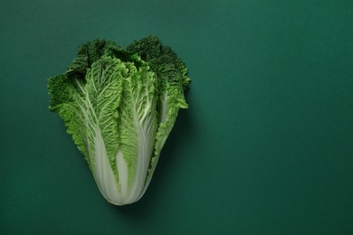 Photo of Fresh ripe Chinese cabbage on green background, top view. Space for text